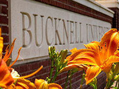 Flowers in front of a Bucknell University sign. Links to Gifts of Life Insurance